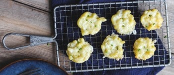 Cauliflower Mac and Cheese Bites on a cooling rack