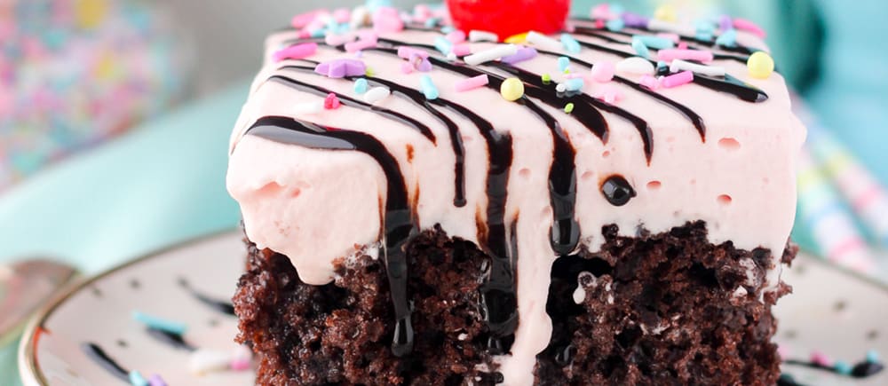 slice of Strawberry Milkshake Poke Cake