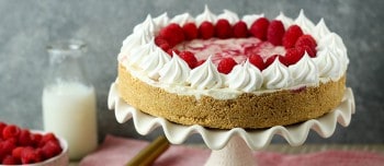 Raspberry Swirl Cheesecake on a cake stand