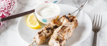 Greek yogurt marinated pork kebobs on a plate
