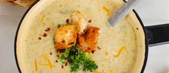 Instant Pot Broccoli Cheese Soup in a bowl and topped with croutons