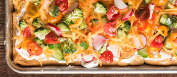 Cold veggie pizza in a pan