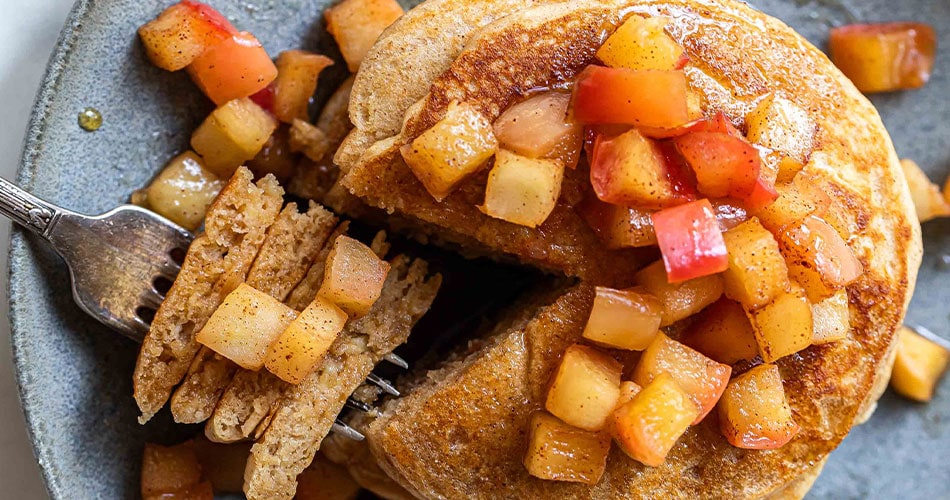 Fork going into a stack of Apple Cinnamon Pancakes