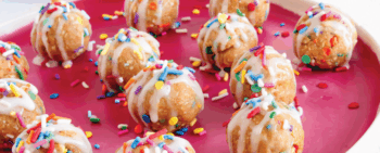 birthday cake protein bites on a plate