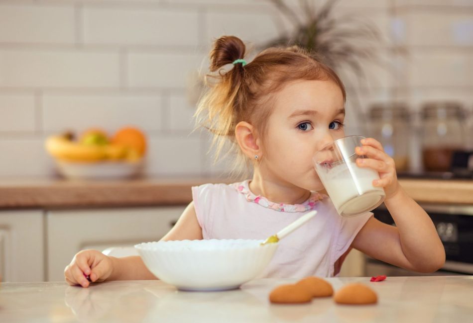 Happy Little Girl Child 2-3 Years Old Eats Healthy Food