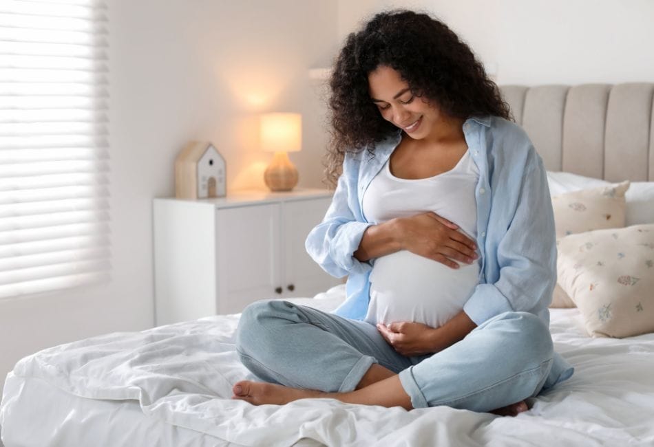 Pregnant Woman on Bed at Home