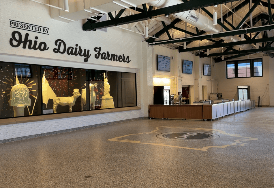 Interior of Dairy Building at Ohio State Fair. Ohio dairy farmers sign with butter cow and calf display.