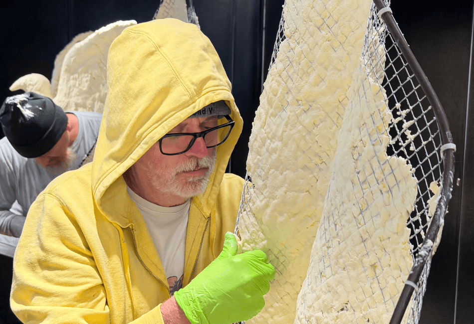 Man in Yellow Jacket Sculpting Butter