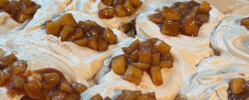 Plate of Apple Pie Cinnamon Rolls with Maple Cream Cheese Frosting