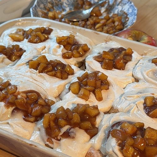 Plate of Apple Pie Cinnamon Rolls with Maple Cream Cheese Frosting