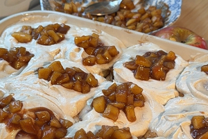 Plate of Apple Pie Cinnamon Rolls with Maple Cream Cheese Frosting